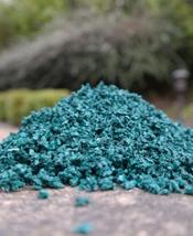 Emerald rubber crumb chippings in a pile 