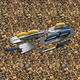 overhead photo of resin bound trowels with yellow and blue handles for resin bound installation