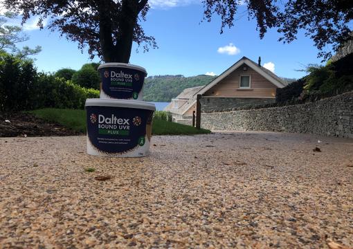 close up shot of new resin bound driveway and resin tubs at lake windermere