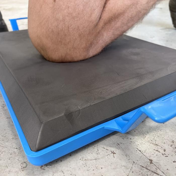 A photo of OX Kneeling Board being used by tradesman