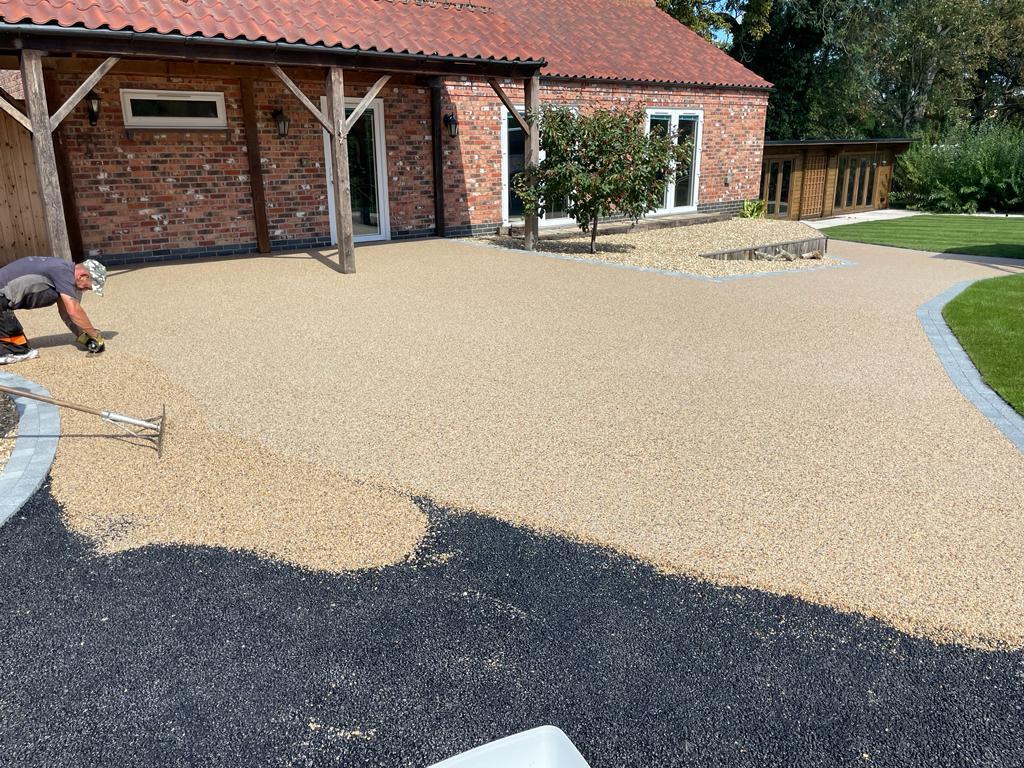 resin bound path and patio being laid using Daltex Riviera 